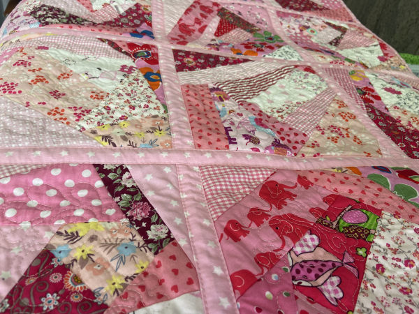 Quiltdecke in rosa rot pink